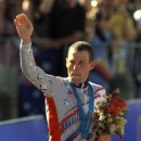 FILE - In a Sept. 30, 2000 file photo, U.S. cyclist Lance Armstrong waves after receiving the bronze medal in the men's individual time trials at the 2000 Summer Olympics cycling road course in Sydney, Australia. Officials familiar with the decision tell The Associated Press the IOC has stripped Armstrong of his bronze medal from the 2000 Sydney Olympics because of his involvement in doping. Two officials say the IOC sent a letter to Armstrong on Wednesday night, Jan. 16, 2013, asking him to return the medal. (AP Photo/Ricardo Mazalan, File)