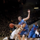 Missouri's Laurence Bowers, left, drives past Florida's Erik Murphy during the first half of an NCAA college basketball game Tuesday, Feb. 19, 2013, in Columbia, Mo. (AP Photo/L.G. Patterson)