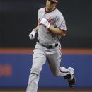 Washington Nationals Bryce Harper, right, trots the bases after hitting a first-inning, two-run home run off New York Mets starting pitcher Chris Young in their baseball game at Citi Field in New York, Monday, July 23, 2012. (AP Photo/Kathy Willens)