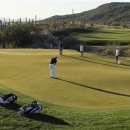 Webb Simpson putts on the 18th green in the quarterfinal round of play against Hunter Mahan during the Match Play Championship golf tournament, Saturday, Feb. 23, 2013, in Marana, Ariz. Mahan won 1-up. (AP Photo/Ross D. Franklin)