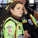 Driver Danica Patrick takes a break during practice for the Quaker State 400 NASCAR Sprint Cup series auto race at Kentucky Speedway in Sparta, Ky., Friday, June 28, 2013. (AP Photo/James Crisp)