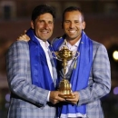 Team Europe golfer Sergio Garcia (R) of Spain holds the Ryder Cup with captain Jose Maria Olazabal after the closing ceremony of the 39th Ryder Cup at the Medinah Country Club in Medinah, Illinois, September 30, 2012.