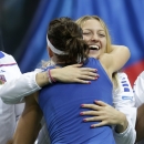 Czech Republic's Lucie Safarova, left, celebrates with her teammate Petra Kvitova, right, after defeating Germany's Angelique Kerber during their Fed Cup Final tennis match between Czech Republic and Germany in Prague, Czech Republic, Saturday, Nov. 8, 2014. Safarova won the match 6-4, 6-4 and gave Czech Republic a 2-0 lead. (AP Photo/Petr David Josek)