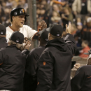 San Francisco Giants' Hunter Pence, top left, is congratulated after scoring against the Los Angeles Dodgers during the sixth inning of a baseball game in San Francisco, Wednesday, Sept. 25, 2013. (AP Photo/Jeff Chiu)