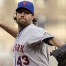 New York Mets pitcher R.A. Dickey throws during the first inning of a baseball game against the Pittsburgh Pirates in Pittsburgh on Tuesday, May 22, 2012. (AP Photo/Gene J. Puskar)