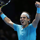 Rafael Nadal of Spain celebrates after winning the ATP World Tour Finals singles tennis match against Stanislas Wawrinka of Switzerland at the O2 Arena in London Wednesday, Nov. 6, 2013. (AP Photo/Sang Tan)