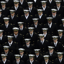 Navy Midshipmen march onto the field before an NCAA college football game between the Army and the Navy Saturday, Dec. 8, 2012, in Philadelphia. (AP Photo/Matt Rourke)