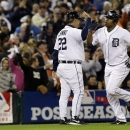 Detroit Tigers' Delmon Young is congratulated by third base coach Gene Lamont after hitting a home run in the fourth inning during Game 3 of the American League championship series against the New York Yankees Tuesday, Oct. 16, 2012, in Detroit. (AP Photo/Paul Sancya )