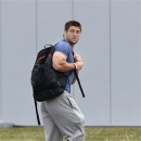 FILE - In this Monday, April 15, 2013 file photo, New York Jets quarterback Tim Tebow arrives on the first day of NFL football offseason workouts at the Jets practice facility in Florham Park, N.J. The New York Jets say, Monday, April 29, 2013, they have waived Tebow. (AP Photo/Mel Evans, File)