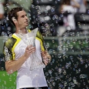 Andy Murray, of Britain, holds the trophy after defeating David Ferrer of Spain in the Sony Open Tennis Tournament in Key Biscayne, Fla., Sunday, March 31, 2013. Murray won 2-6, 6-4, 7-6 (1). (AP Photo/J Pat Carter)