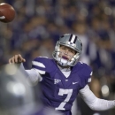 Kansas State quarterback Collin Klein passes to wide receiver Tyler Lockett during the first half of an NCAA college football game against Oklahoma State in Manhattan, Kan., Saturday, Nov. 3, 2012. (AP Photo/Orlin Wagner)