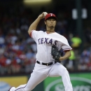 Texas Rangers starting pitcher Yu Darvish, of Japan, throws during the first inning of a baseball game against the Los Angeles Angels, Sunday, April 7, 2013, in Arlington, Texas. (AP Photo/LM Otero)