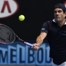 Guillermo Garcia-Lopez of Spain makes a forehand return to Stan Wawrinka of Switzerland during their fourth round match at the Australian Open tennis championship in Melbourne, Australia, Monday, Jan. 26, 2015. (AP Photo/Andy Brownbill)