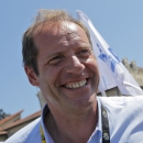 Tour de France director Christian Prudhomme smiles prior to the start of the sixteenth stage of the Tour de France cycling race over 201 kilometers (124.9 miles) with start in Bourg-de-Peage and finish in Gap, France, Monday, July 20, 2015. (AP Photo/Christophe Ena)