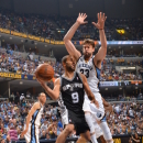 MEMPHIS, TN - MAY 27: Tony Parker #9 of the San Antonio Spurs passes the ball against Marc Gasol #33 of the Memphis Grizzlies in Game Four of the Western Conference Finals during the 2013 NBA Playoffs on May 27, 2013 at FedEx Forum in Memphis, Tennessee. (Photo by Jesse D. Garrabrant/NBAE via Getty Images)