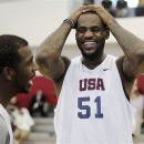 USA men's national basketball team member LeBron James (51) laughs with teammate Chris Paul during practice at the Mendenhall Center on the UNLV campus in Las Vegas on Friday, July 6, 2012.  (AP Photo/Las Vegas Review-Journal, Jason Bean)