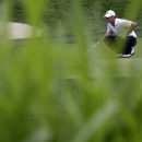 Jordan Spieth inspects his putt on the 11th green during the second round of the AT&T National golf tournament at Congressional Country Club, Friday, June 28, 2013, in Bethesda, Md. (AP Photo/Patrick Semansky)