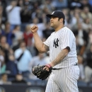 New York Yankees relief pitcher Joba Chamberlain pumps his fist after striking out Toronto Blue Jays' Melky Cabrera for the final out in the ninth inning of a baseball game at Yankee Stadium on Saturday, April 27, 2013 in New York. The Yankees won 5-4. (AP Photo/Kathy Kmonicek)