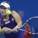 Samantha Stosur of Australia returns a shot against Petra Kvitova of the Czech Republic during a semifinal match of the China Open tennis tournament at the National Tennis Stadium in Beijing, China, Saturday, Oct. 4, 2014. (AP Photo/Vincent Thian)