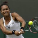 Heather Watson of Britain returns a shot to Jamie Lee Hampton of the United States during a second round women's singles match at the All England Lawn Tennis Championships at Wimbledon, England, Wednesday, June 27, 2012. (AP Photo/Alastair Grant)
