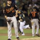 Baltimore Orioles' Joe Saunders, left, waits for Oakland Athletics' Yoenis Cespedes to run the bases after Cespedes hit a two-run home run during the fourth inning of a baseball game Friday, Sept. 14, 2012, in Oakland, Calif. (AP Photo/Ben Margot)