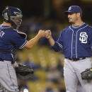 San Diego Padres starting pitcher Jason Marquis, right, is congratulated by catcher Nick Hundley as he is taken out of the game during the eighth inning of their baseball game against the Los Angeles Dodgers, Tuesday, April 16, 2013, in Los Angeles. (AP Photo/Mark J. Terrill)