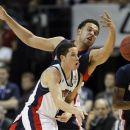 Saint Mary's Jorden Page, left, passes the ball off against Gonzaga's Elias Harris in the first half during the NCAA West Coast Conference tournament championship basketball game, Monday, March 5, 2012, in Las Vegas. (AP Photo/Julie Jacobson)