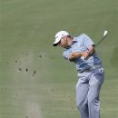 Sergio Garcia of Spain hits an approach shot on the 18th hole during the first round of the Colonial golf tournament Thursday, May 24, 2012, in Fort Worth, Texas. (AP Photo/LM Otero)