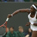 Sloane Stephens of the United States serves to Petra Cetkovska of the Czech Republic during their Women's singles match at the All England Lawn Tennis Championships in Wimbledon, London, Friday, June 28, 2013. (AP Photo/Alastair Grant)