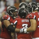 Atlanta Falcons kicker Matt Bryant (3) is embraced by teammates after Bryant kicked a 55-yard long field goal during the second half of an NFL football game against the Oakland Raiders, Sunday, Oct. 14, 2012, in Atlanta. (AP Photo/John Bazemore)