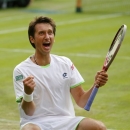 Sergiy Stakhovsky of Ukraine reacts as he wins against Roger Federer of Switzerland in their Men's second round singles match at the All England Lawn Tennis Championships in Wimbledon, London, Wednesday, June 26, 2013. (AP Photo/Anja Niedringhaus)