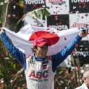Takuma Sato, of Japan, celebrates his victory in the IndyCar Series Grand Prix of Long Beach auto race, Sunday, April 21, 2013, in Long Beach, Calif. Sato became the first Japanese driver to win an IndyCar race. (AP Photo/Ringo H.W. Chiu)
