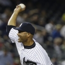 New York Yankees' Mariano Rivera delivers a pitch during the ninth inning of a baseball game against the Tampa Bay Rays, Friday, June 21, 2013, in New York. The Yankees won the game 6-2. (AP Photo/Frank Franklin II)