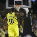Michigan guard Tim Hardaway Jr. (10) reacts to a 3-point shot against the Louisville during the first half of the NCAA Final Four tournament college basketball championship game Monday, April 8, 2013, in Atlanta. (AP Photo/John Bazemore)