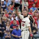 Retiring Atlanta Braves' Chipper Jones salutes the crowd as he enters the batter's box during the second inning of their baseball game against the New York Mets at Turner Field Sunday, Sept. 30, 2012, in Atlanta. (AP Photo/David Tulis)