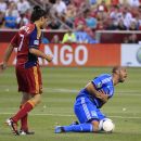 SANDY, UT - JUNE 23: Victor Bernardez #26 of the San Jose Earthquakes grabs his chest after falling on the ball as Fabian Espindola #7 of Real Salt Lake looks on during the second half of an MLS soccer game June 23, 2012 at Rio Tinto Stadium in Sandy, Utah. San Jose Earthquakes beat Real Salt Lake 2-1. (Photo by George Frey/Getty Images)