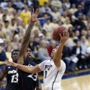 Pittsburgh's James Robinson (0) shoots in front of Cincinnati's Sean Kilpatrick (23) in the first half of the NCAA college basketball game, Monday, Dec. 31, 2012, in Pittsburgh. (AP Photo/Keith Srakocic)