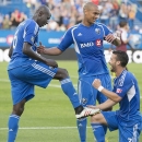 Montreal Impact's Felipe Martins, right, and Sanna Nyassi ,center, celebrate a goal by Hassoun Camara, left, during the first half of an MLS soccer against the Colorado Rapids in Montreal on Saturday, June 29, 2013. (AP Photo/The Canadian Press, Peter McCabe)