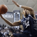 Georgetown's Otto Porter Jr. goes up for the game-winning basket during the second overtime of an NCAA college basketball game against Connecticut in Storrs, Conn., Wednesday, Feb. 27, 2013. Georgetown won 79-78. (AP Photo/Jessica Hill)