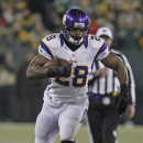 Minnesota Vikings running back Adrian Peterson in action against the Green Bay Packers during an NFL wild card playoff football game Saturday, Jan. 5, 2013, in Green Bay, Wis. (AP Photo/Matt Ludtke)