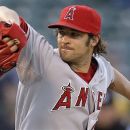 Los Angeles Angels' C.J. Wilson works against the Oakland Athletics during the first inning of a baseball game, Tuesday, May 22, 2012, in Oakland, Calif. (AP Photo/Ben Margot)