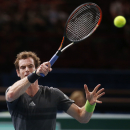 Andy Murray of Britain, returns the ball to Novak Djokovic of Serbia during their quarterfinal match at the ATP World Tour Masters tennis tournament at Bercy stadium in Paris, France, Friday, Oct. 31, 2014. (AP Photo/Michel Euler)