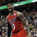 Miami Heat's LeBron James (6) reacts after he scores on a dunk during the second half of an NBA basketball game against the Philadelphia 76ers, Saturday, Feb. 23, 2013, in Philadelphia. The Heat won, 114-90. (AP Photo/Michael Perez)