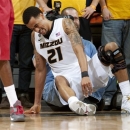 Missouri's Laurence Bowers struggles to get off the ground after he injured his knee during the second half of an NCAA college basketball game against Alabama on Tuesday, Jan. 8, 2013, in Columbia, Mo. Missouri won the game 84-68. Bowers did not return to the game. (AP Photo/L.G. Patterson)