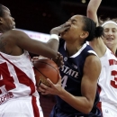 Wisconsin's Tiera Stephen, left, fouls Penn State's Mia Nickson during the first half of an NCAA college basketball game Thursday, Jan. 31, 2013, in Madison, Wis. (AP Photo/Andy Manis)