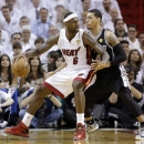 Miami Heat small forward LeBron James (6) and San Antonio Spurs shooting guard Danny Green (4) work during the first half of Game 1 of basketball's NBA Finals, Thursday, June 6, 2013 in Miami. (AP Photo/Lynne Sladky)