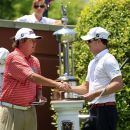 Jason Dufner, left, shakes hands with Zach Johnson before the final round of the PGA Colonial golf tournament, Sunday, May 27, 2012, in Fort Worth, Texas. (AP Photo/LM Otero)