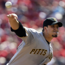 Pittsburgh Pirates starting pitcher Charlie Morton throws against the Cincinnati Reds in the first inning of a baseball game, Saturday, Sept. 28, 2013, in Cincinnati. (AP Photo/Al Behrman)