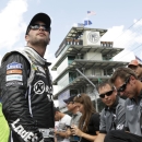 Sprint Cup Series driver Jimmie Johnson looks up a the scoring pylon during qualifications for the Brickyard 400 auto race at the Indianapolis Motor Speedway in Indianapolis, Saturday, July 27, 2013. Johnson qualified with a speed of 187.438. (AP Photo/AJ Mast)