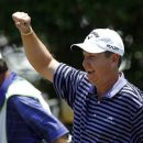 J.J. Henry celebrates his hole-in-one on the fifth hole during the final round of the PGA Byron Nelson Championship golf tournament on Sunday, May 20, 2012, in Irving, Texas. (AP Photo/Tony Gutierrez)